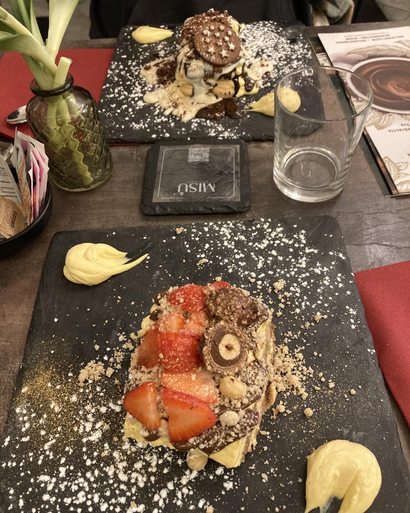 Strawberry tiramisù with cream and crumble, on the table with the red placemat